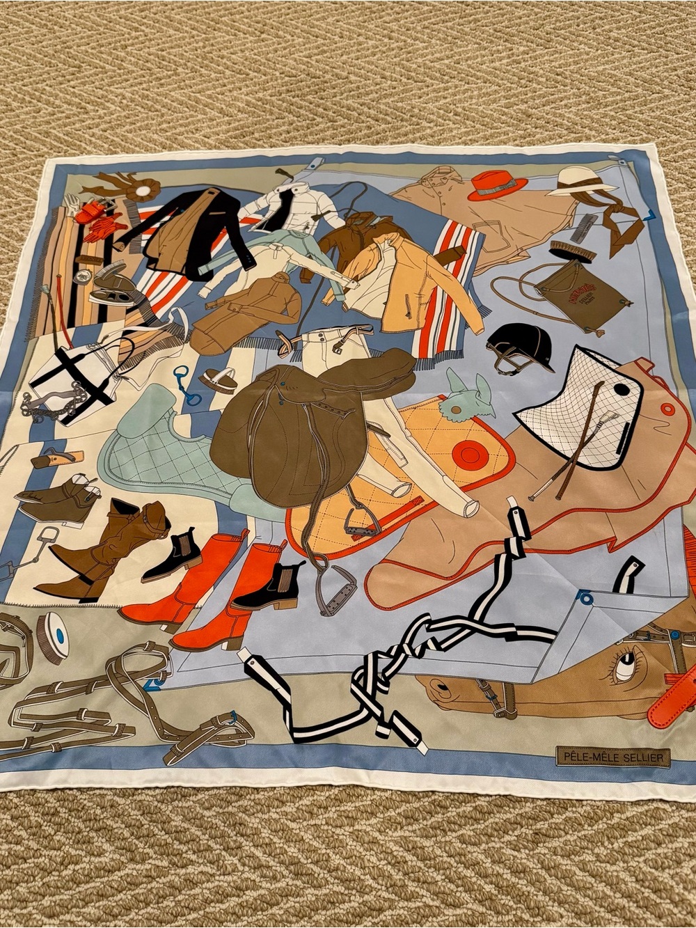 Hermes Pele Mele Silk Scarf with leather buckle.